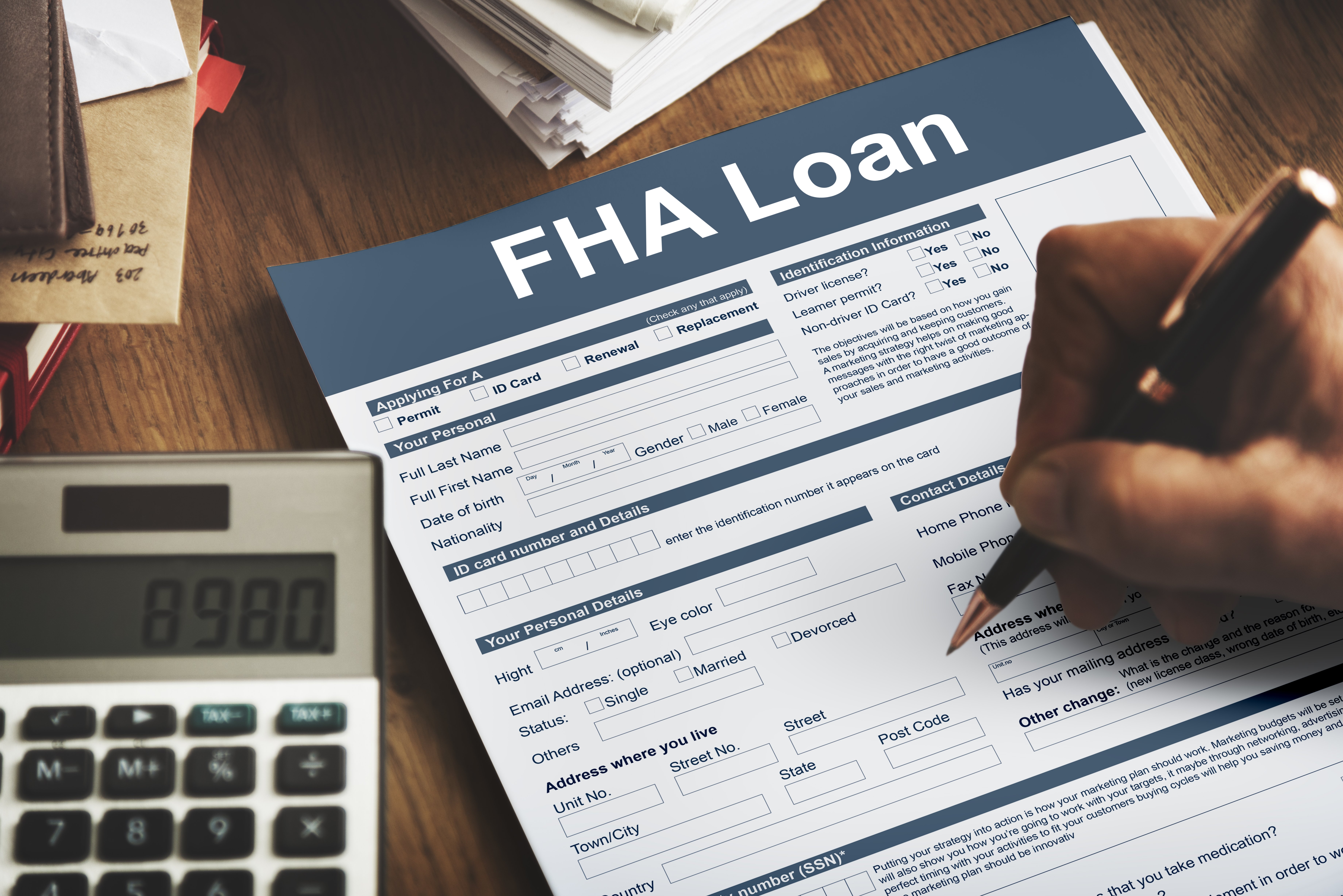 Image of a person filling out an FHA Loan Federal Housing Administration Lending 