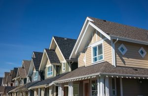 Image showing a row of newly constructed townhomes representing subdivision laws in Maryland.