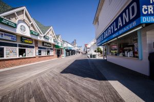 Ocean City, Maryland - April 3, 2018: Empty boardwalk with no people and closed restaurants and stores in early spring during a weekday. This is a slow time of year for Ocean City