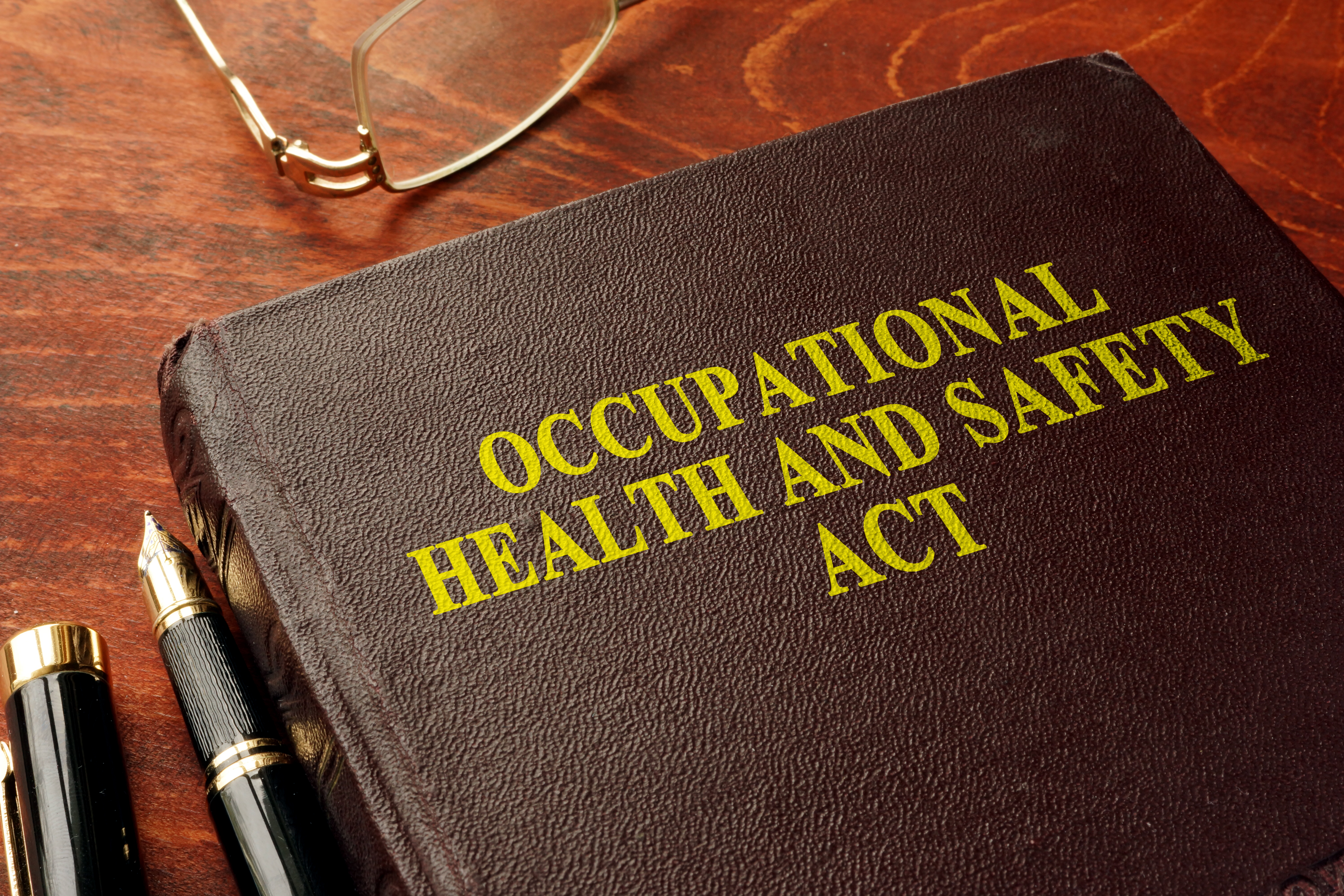 Image of OSHA policy book representing OSHA recommendations for unvaccinated employees. 