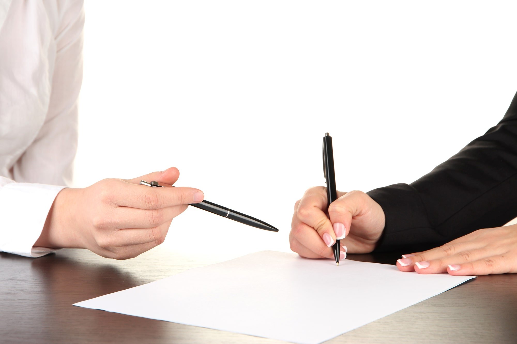 Image of a person signing a Trust with an attorney.
